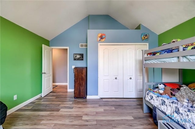 7221 Apache Trl, Holland, OH 43528 - bedroom featuring wood finished floors, a closet, baseboards, and high vaulted ceiling