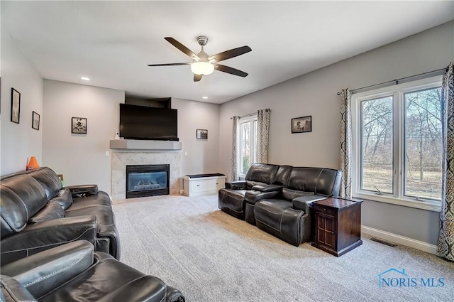 7221 Apache Trl, Holland, OH 43528 - living area with a ceiling fan, carpet, plenty of natural light, a tiled fireplace, and recessed lighting