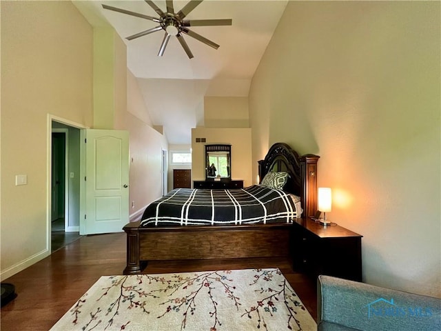 7221 Apache Trl, Holland, OH 43528 - bedroom featuring dark wood-type flooring, high vaulted ceiling, baseboards, and ceiling fan