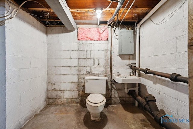 bathroom featuring toilet, unfinished concrete floors, electric panel, and a sink