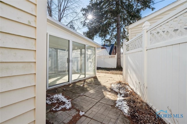 view of patio featuring fence