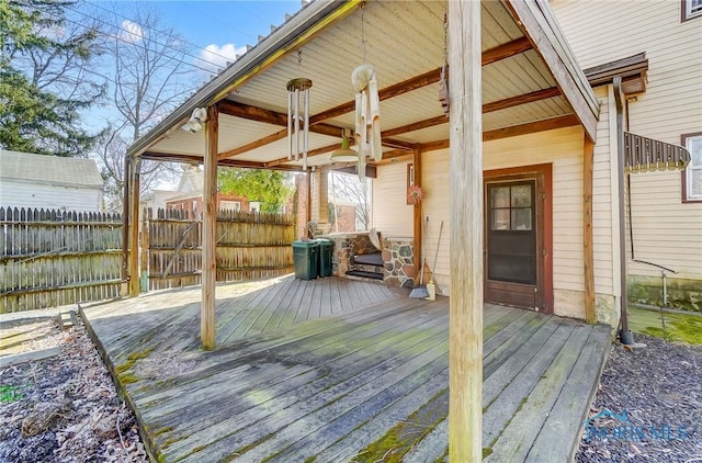 wooden terrace featuring fence