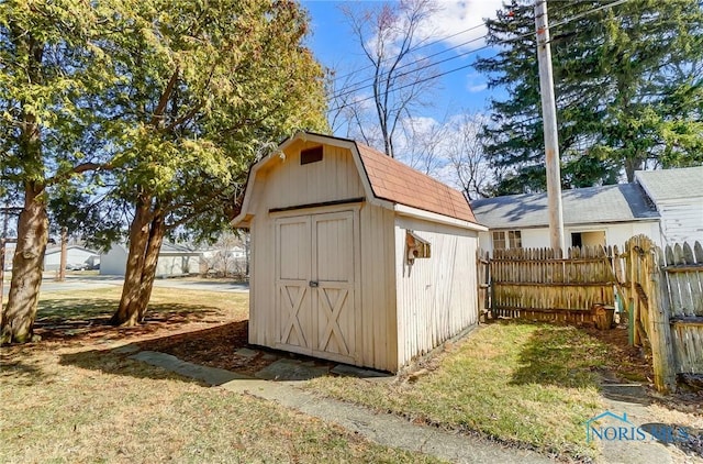 view of shed with fence