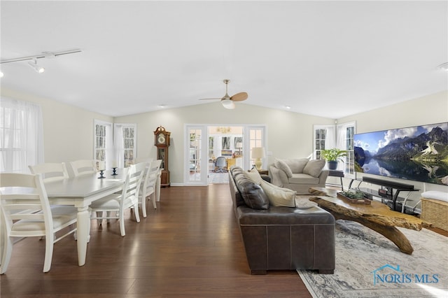 living area with ceiling fan, french doors, lofted ceiling, and wood finished floors