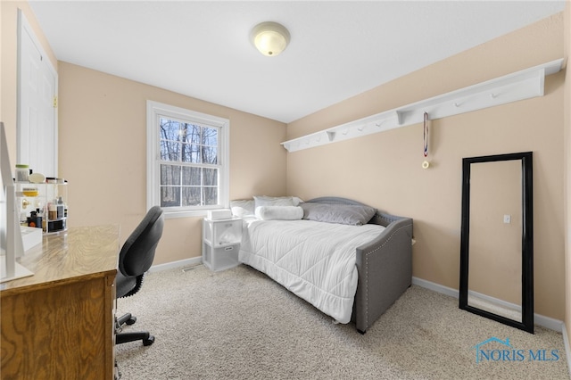 carpeted bedroom with baseboards