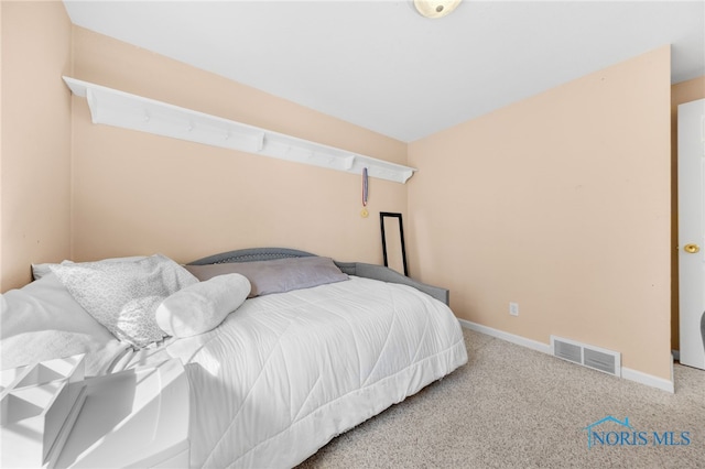 bedroom featuring carpet, visible vents, and baseboards