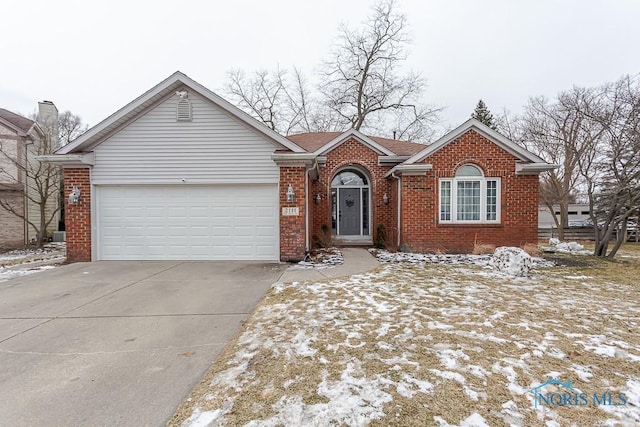 ranch-style home with concrete driveway, an attached garage, and brick siding