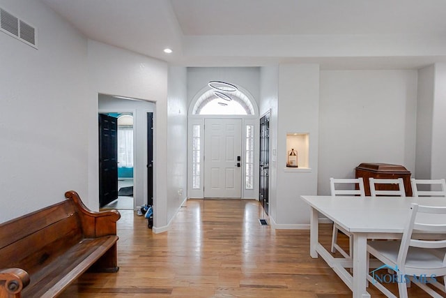 foyer entrance featuring recessed lighting, visible vents, baseboards, and light wood-style flooring