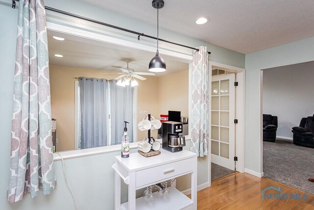 office area featuring ceiling fan, recessed lighting, wood finished floors, and baseboards