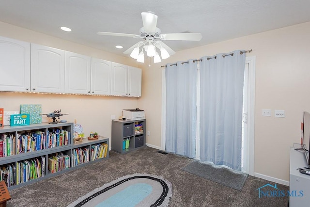 playroom with dark colored carpet, baseboards, recessed lighting, and a ceiling fan