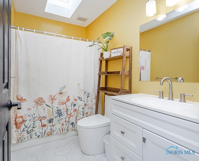 full bathroom featuring vanity, a shower with shower curtain, visible vents, a skylight, and toilet