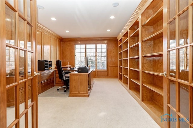 office space with recessed lighting, light carpet, wooden walls, and crown molding