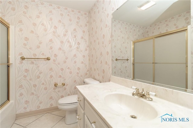 full bathroom featuring tile patterned floors, toilet, wallpapered walls, and vanity