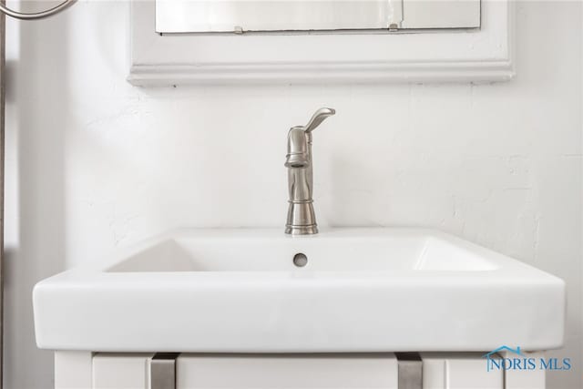 interior details featuring a sink