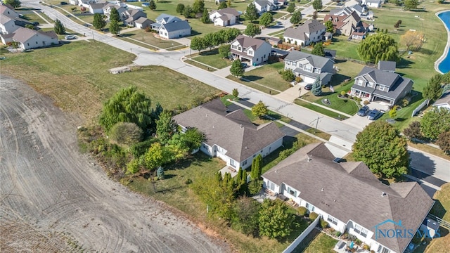 birds eye view of property with a residential view