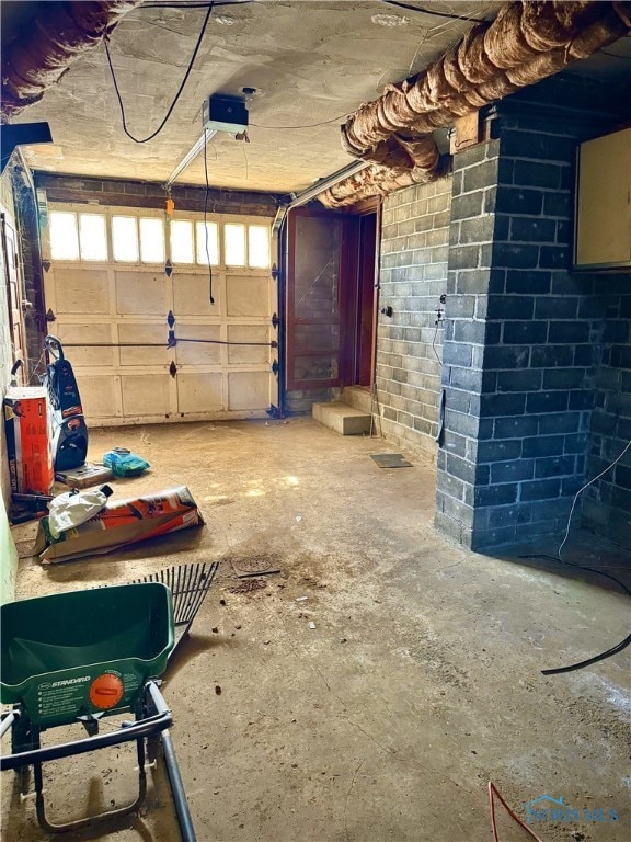 garage with concrete block wall