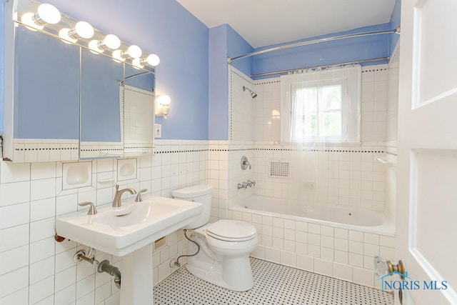 121 Eagle Point Dr, Rossford, OH 43460 - bathroom with tiled shower / bath, toilet, tile walls, and tile patterned flooring