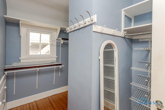 121 Eagle Point Dr, Rossford, OH 43460 - walk in closet featuring wood finished floors