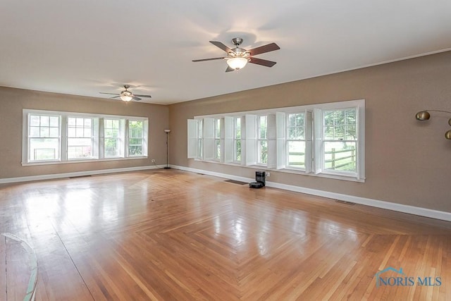 121 Eagle Point Dr, Rossford, OH 43460 - unfurnished living room featuring ceiling fan and baseboards