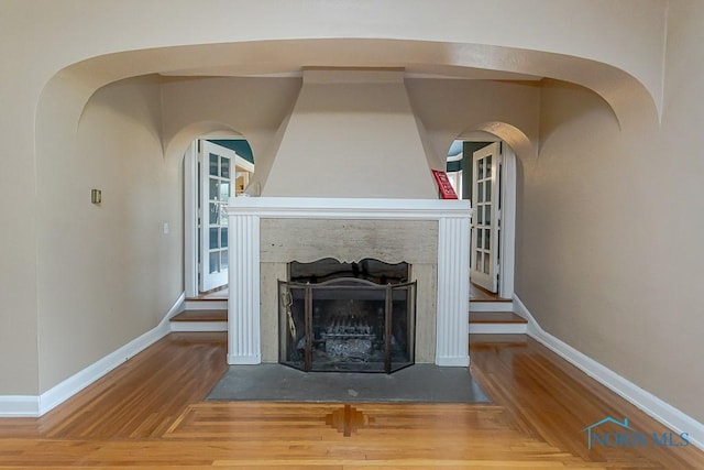 121 Eagle Point Dr, Rossford, OH 43460 - detailed view of baseboards, wood finished floors, and arched walkways