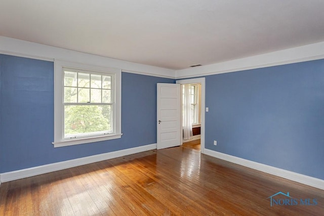 121 Eagle Point Dr, Rossford, OH 43460 - spare room featuring baseboards and wood-type flooring