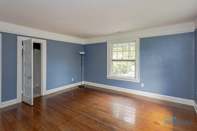 121 Eagle Point Dr, Rossford, OH 43460 - empty room featuring baseboards and wood-type flooring