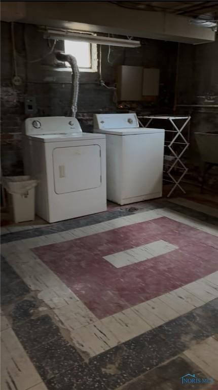 washroom featuring laundry area and washer and dryer