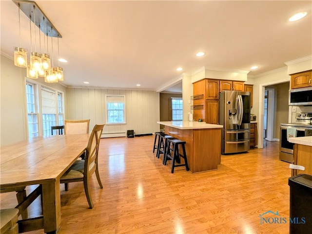 509 Oakwood Ave, Bryan, OH 43506 - dining room with a baseboard radiator, crown molding, light wood-style floors, and recessed lighting