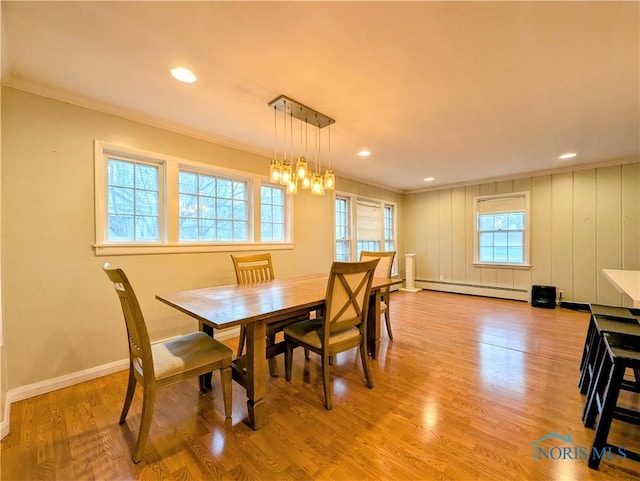 509 Oakwood Ave, Bryan, OH 43506 - dining space featuring ornamental molding, light wood-style flooring, and baseboard heating