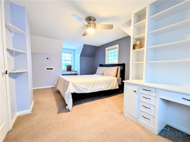 509 Oakwood Ave, Bryan, OH 43506 - bedroom with baseboards, lofted ceiling, ceiling fan, and light carpet