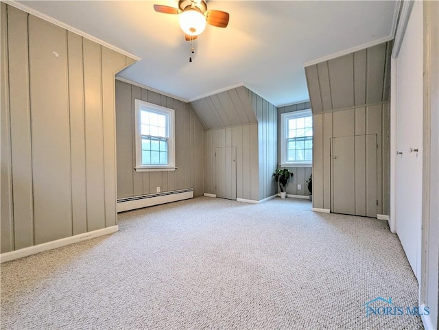 509 Oakwood Ave, Bryan, OH 43506 - additional living space with baseboard heating, carpet floors, and a ceiling fan