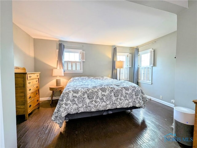 509 Oakwood Ave, Bryan, OH 43506 - bedroom featuring dark wood-style floors and baseboards