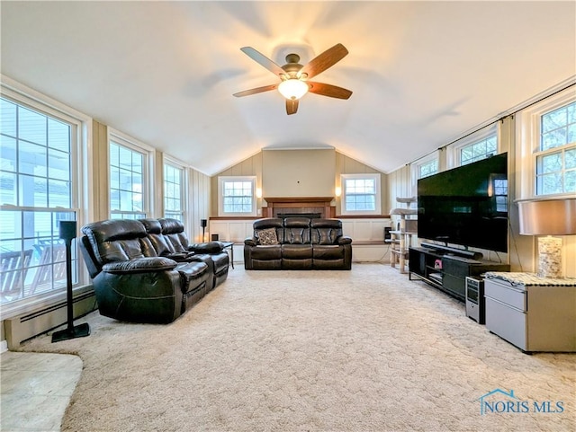 509 Oakwood Ave, Bryan, OH 43506 - carpeted living room with a baseboard radiator, vaulted ceiling, and ceiling fan
