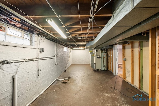 basement with heating unit and water heater