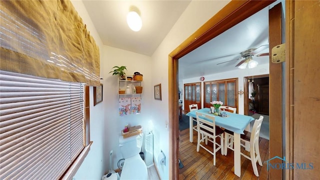 hallway with hardwood / wood-style floors