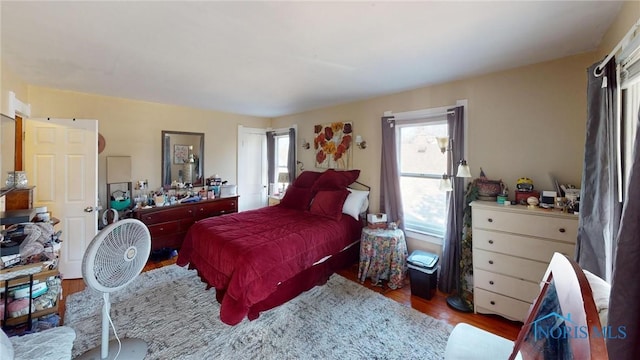 bedroom featuring wood finished floors