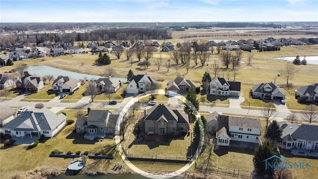 aerial view featuring a residential view and a water view