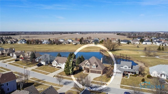 aerial view featuring a residential view and a water view