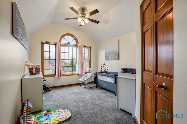 playroom featuring carpet flooring, baseboards, lofted ceiling, and a ceiling fan