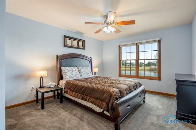 bedroom featuring baseboards, carpet floors, and a ceiling fan