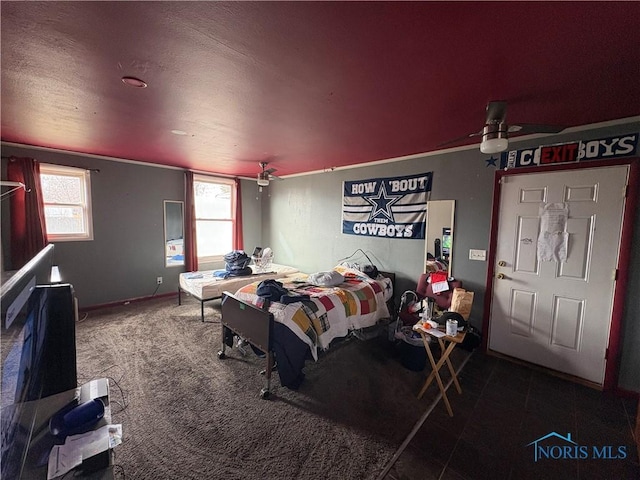 carpeted bedroom featuring multiple windows