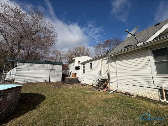 view of yard with entry steps