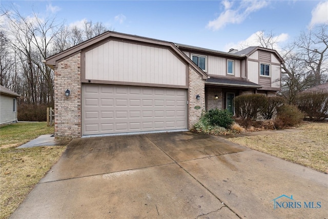 view of front facade featuring concrete driveway, a garage, and a front lawn