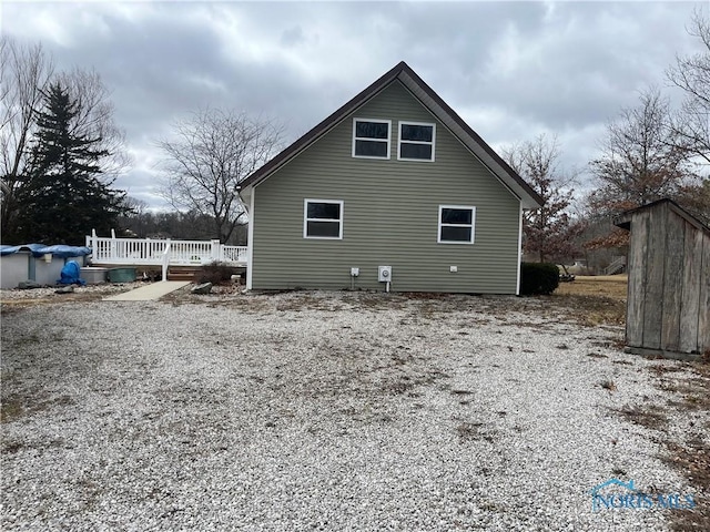 rear view of property with a deck