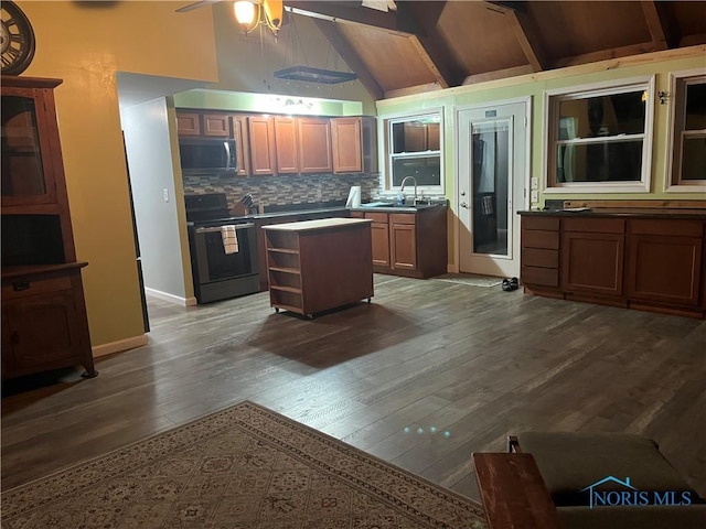 kitchen featuring a ceiling fan, dark wood finished floors, electric range, stainless steel microwave, and backsplash