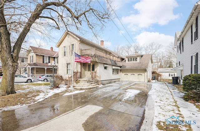 550 Wallace Ave, Bowling Green, OH 43402 - view of front of home with a garage, driveway, and a chimney