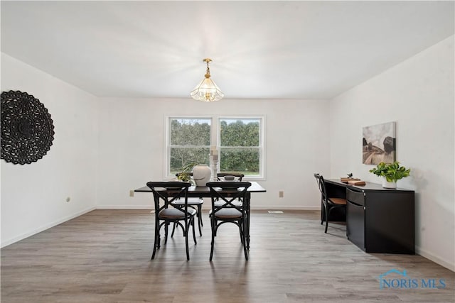 1004 Waterville Monclova Rd, Waterville, OH 43566 - dining space featuring baseboards and wood finished floors
