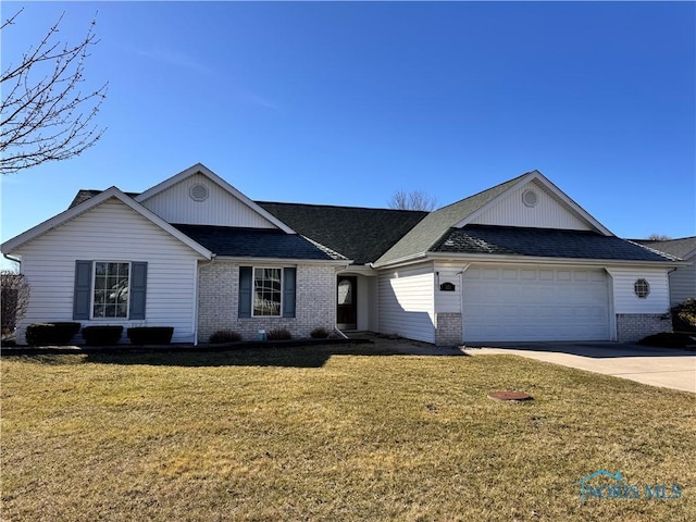 125 Laurie Dr, Bryan, OH 43506 - ranch-style home with brick siding, a garage, driveway, and a front yard