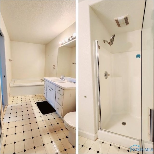 2249 Woods Edge Ct, Toledo, OH 43615 - bathroom with vanity, visible vents, a shower stall, a textured ceiling, and tile patterned floors