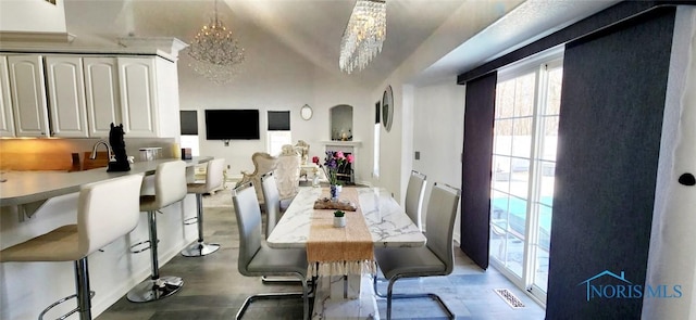 2249 Woods Edge Ct, Toledo, OH 43615 - dining space featuring visible vents, wood finished floors, and a chandelier